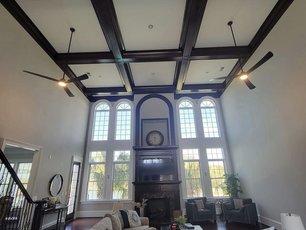 Grand living room with coffered ceiling by MAXXPRO