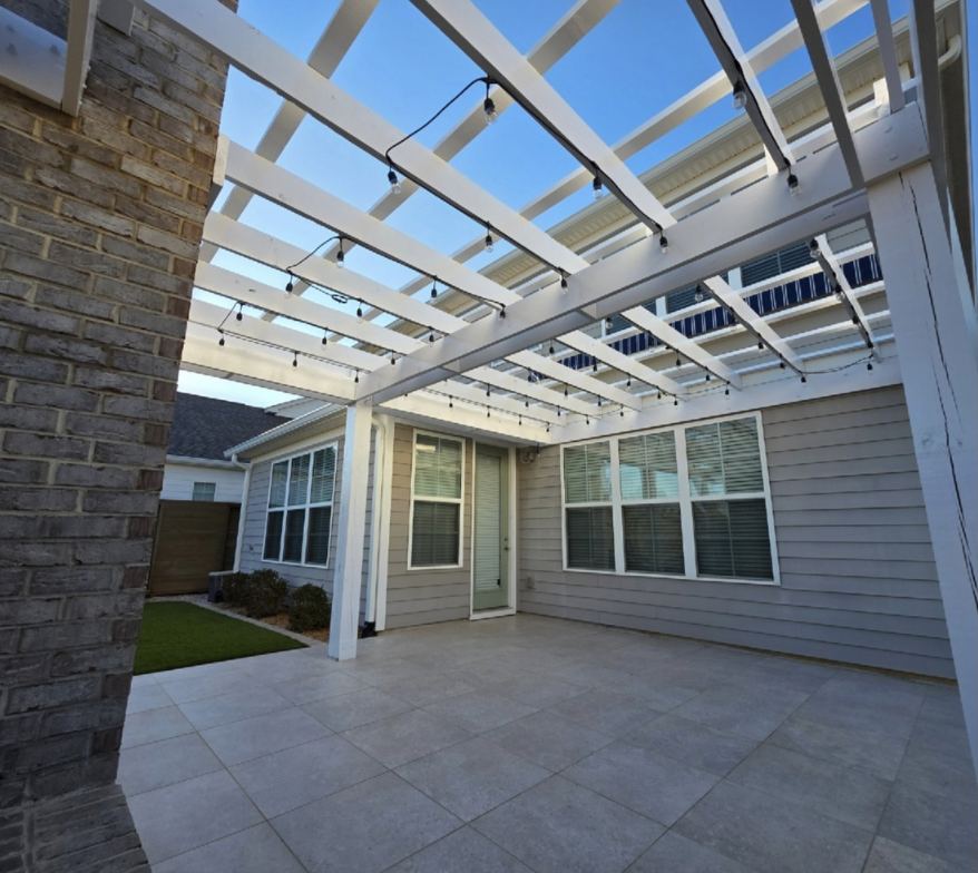 Custom white pergola with string lights by MAXXPRO